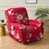 A deep red floral print recliner and sofa slipcover set sitting on a wooden floor.