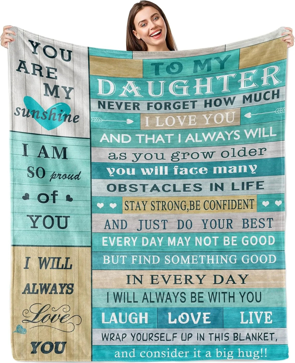 A woman holds a soft printed throw blanket with inspirational text about love and strength.
