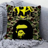 A decorative pillow cover featuring a camouflage pattern with bold yellow text and a black silhouette of a face.