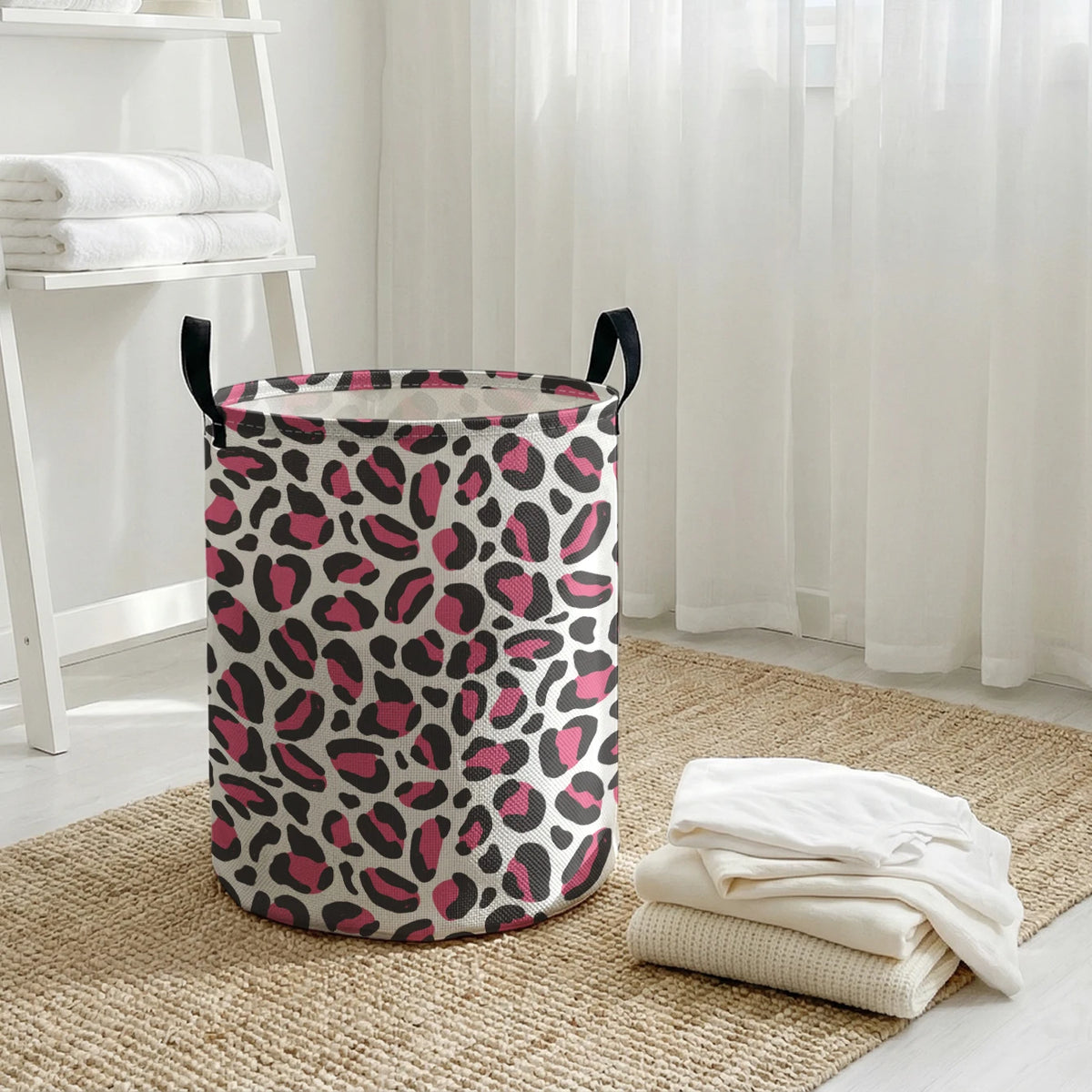 A foldable laundry basket with a leopard print design sits on a woven mat next to a window.