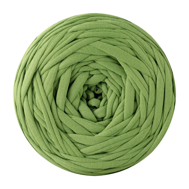 A ball of soft, olive green T-shirt yarn for crochet