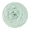 A ball of light mint green T-shirt yarn used for crochet