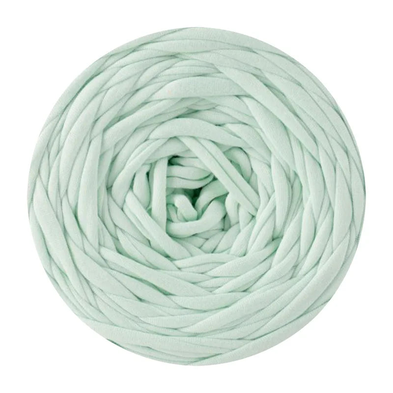 A ball of light mint green T-shirt yarn used for crochet