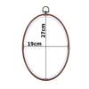 Round wooden embroidery hoop with a 19cm diameter and 27cm height.