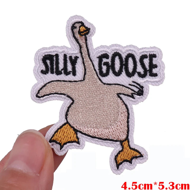 An embroidered patch featuring a cartoon goose with the text SILLY GOOSE on it.
