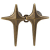 A pair of antique brass star-shaped jean buttons for clothing.