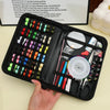 A black sewing kit case is open, displaying various threads, needles, scissors, and crafting tools.