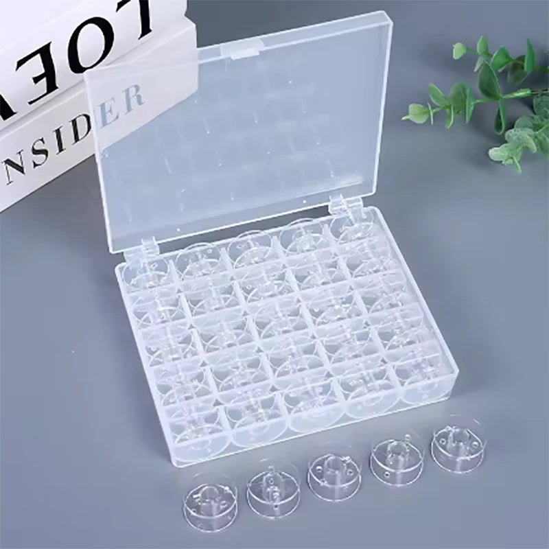 A clear plastic storage case containing a 25-piece set of sewing machine bobbins and several loose bobbins.