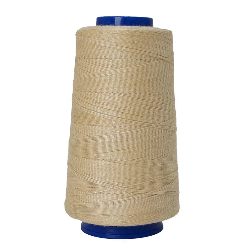 A spool of beige heavy-duty waterproof sewing thread with a blue core.