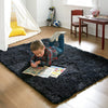A young boy is sitting on a dark shag rug drawing or coloring with a pencil and crayons.