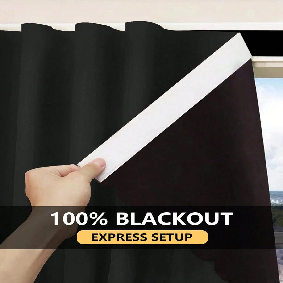 A hand is pulling a black blackout curtain across a window, showing the fabric's texture and layering.