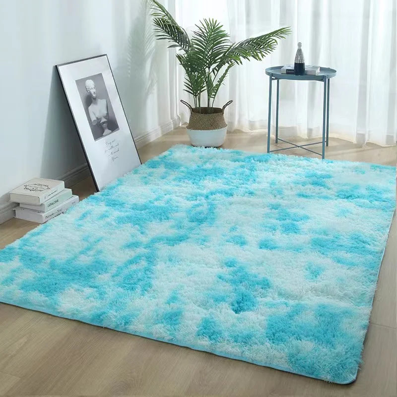 A bright turquoise faux fur area rug placed on a light wood floor.