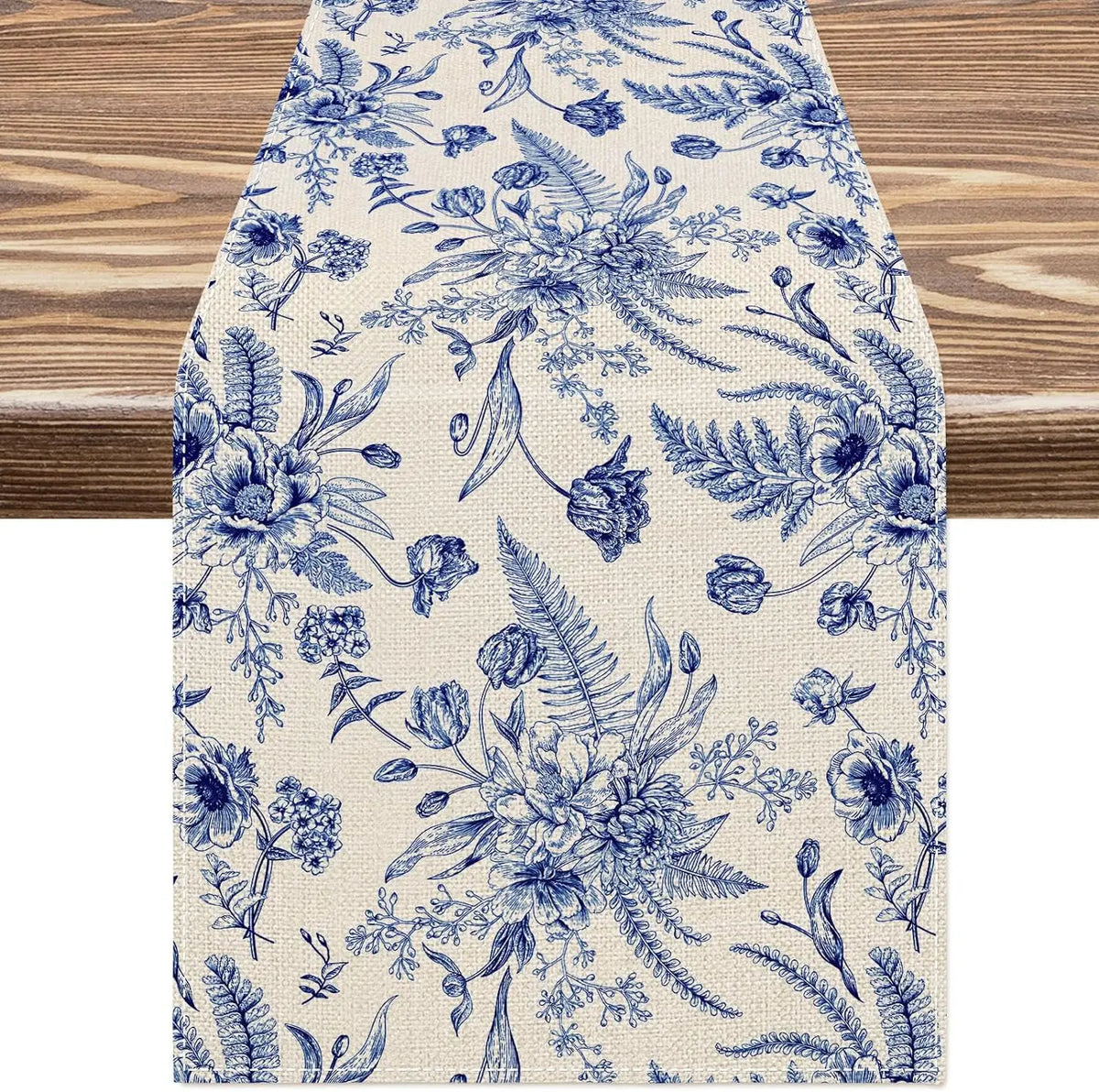 Blue and white porcelain floral linen table runner with delicate botanical patterns