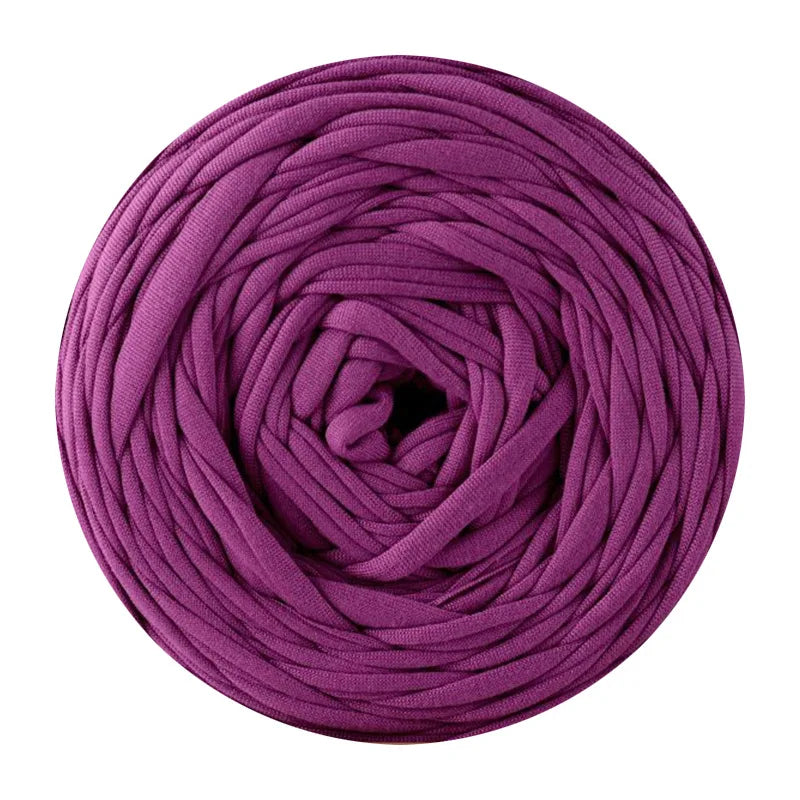 A ball of purple soft t-shirt yarn used for crochet