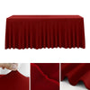 A deep red stretchable waterproof rectangle tablecloth draped over a table.