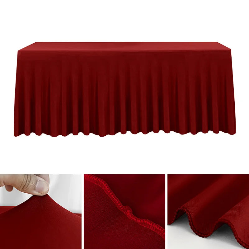 A deep red stretchable waterproof rectangle tablecloth draped over a table.