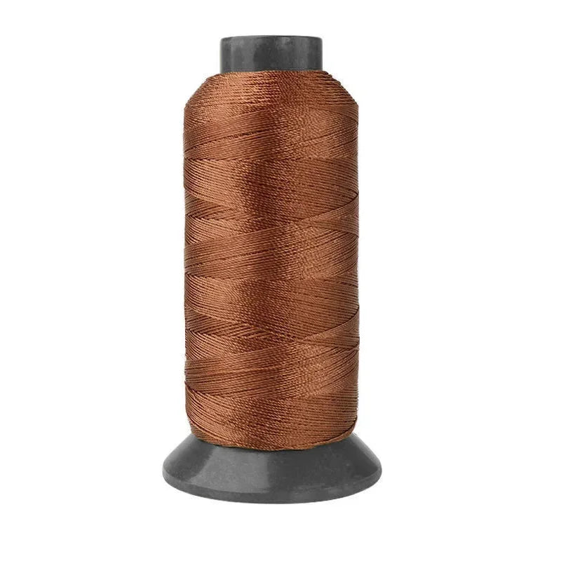 Roll of heavy duty 3-ply nylon sewing thread in a copper brown color.