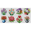 A grid of nine cross stitch designs featuring various colorful flowers in different arrangements and pots.