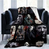 A dark horror themed throw blanket featuring images of Michael Myers and other masked figures.
