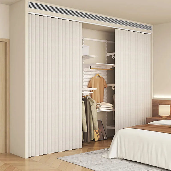 A heavy duty foldable room divider curtain in off-white is shown partially open, revealing a closet with clothing racks.