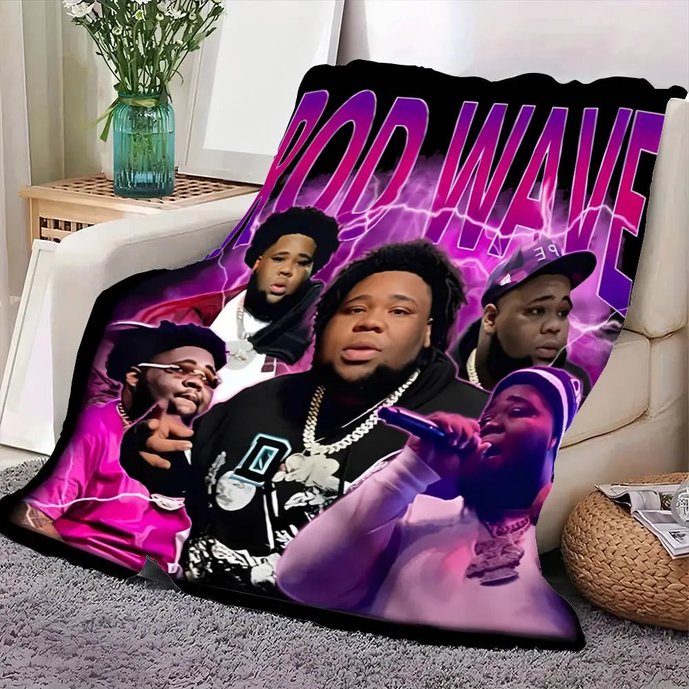 A graphic print featuring a purple and black stylized text design on a fleece throw blanket.