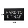 Black embroidered patch with white text that reads HARD TO KIDNAP