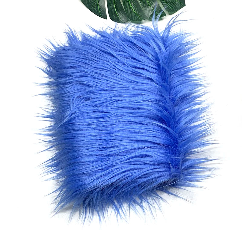 A fluffy bright blue faux fur plush fabric for sewing and crafting.