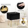 Black faux fur ottoman with gold metal legs showing texture and stability features