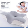 A gray and white butterfly-shaped memory foam neck pillow being used by a woman for sleep.