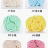 Six balls of hand-woven chunky chenille yarn in white, light blue, green, yellow, beige, and pink.