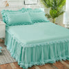 Light mint green princess lace bed skirt set with ruffled fabric and pillows