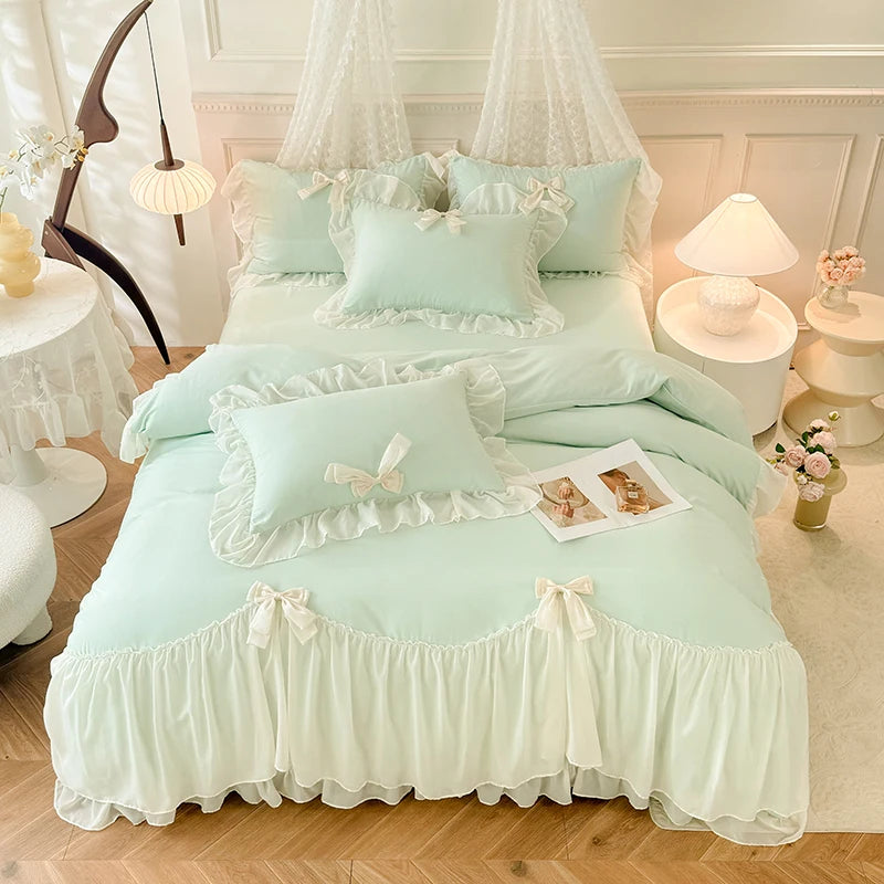 A light mint green princess chiffon duvet cover set displayed on a bed with white and pink accents.