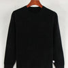 Black crew neck sweater displayed on a wooden hanger.