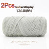 A ball of light gray reusable elastic yarn used for crafting.
