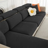 A dark gray jacquard elastic sofa cushion slipcover with decorative orange and white accent pillows.