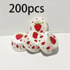 A pile of white oil-proof baking cups decorated with red strawberry patterns.