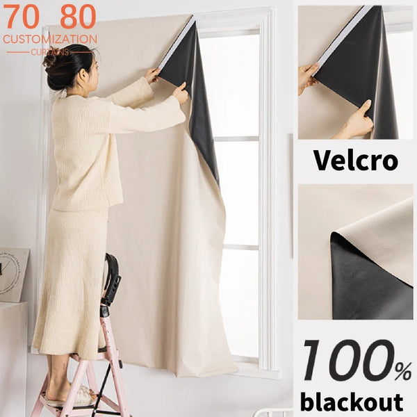 A woman is installing a beige blackout curtain on a window using Velcro, demonstrating customization options.