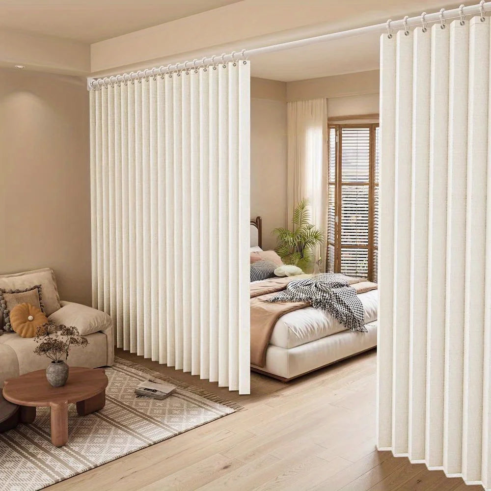 A heavy duty foldable room divider curtain in cream color is shown partially open in a bright, modern interior.