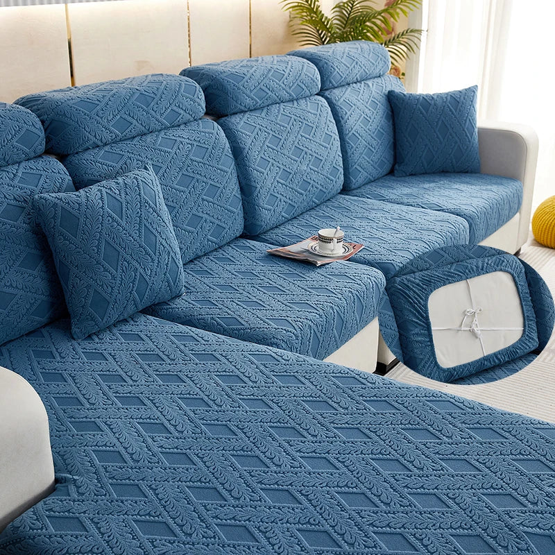 A deep blue jacquard plush sofa cushion cover featuring an intricate diamond pattern on a modern sofa.