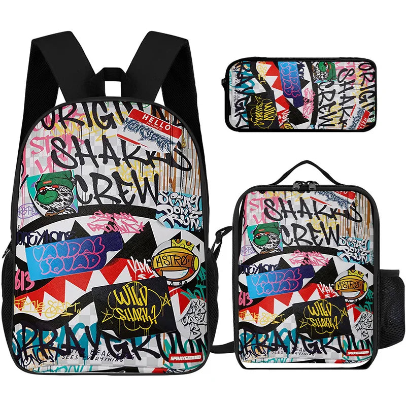 A set of three graphic print backpacks featuring a black and colorful design with shark crew themes.