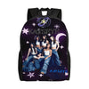 A black canvas backpack featuring a purple and silver design with the text KATSEYE and several female figures.