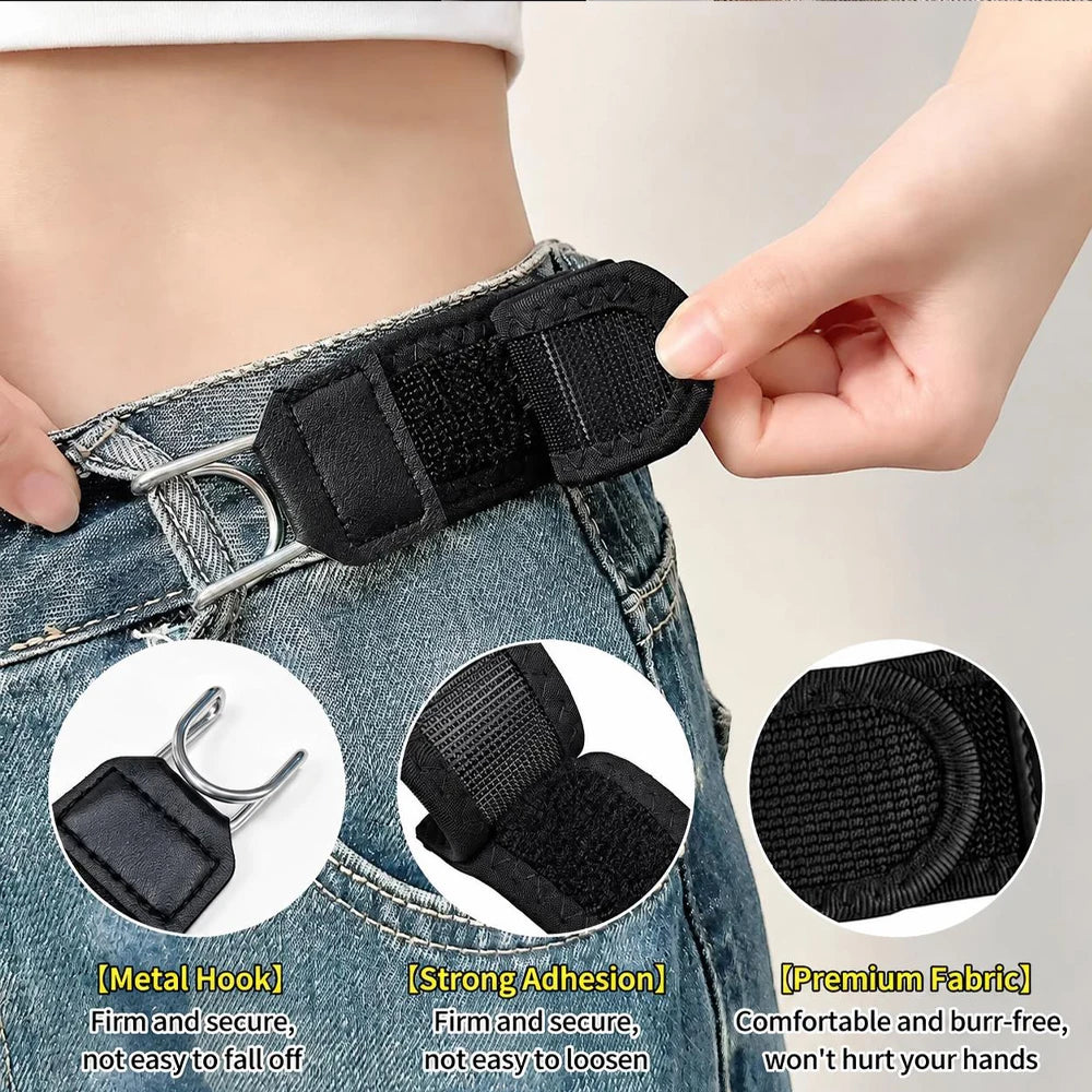 A close-up of a black elastic belt being fastened onto denim jeans using a metal hook and strong adhesive.