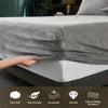 A close-up of a gray velvet bedding set showing the fabric texture and features like ultra soft skin friendly breathable dura