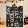 A black flannel patchwork throw blanket featuring various spooky Halloween designs like bats ghosts and pumpkins.