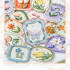 A collection of vintage botanical flower stickers featuring various colors and designs for journaling and scrapbooking