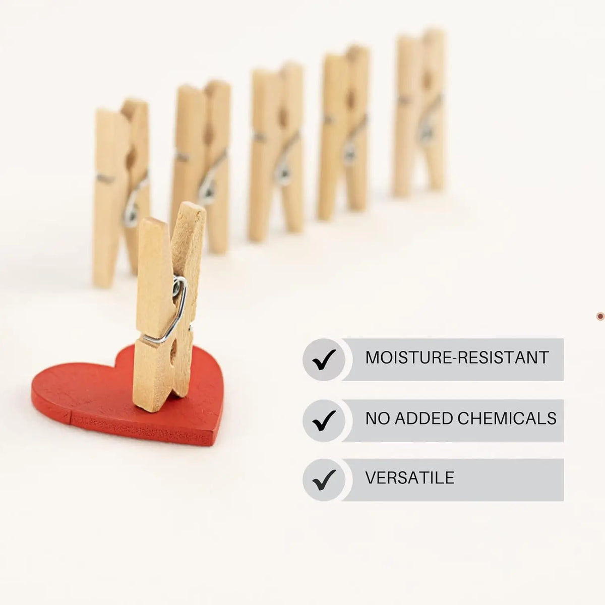 A set of mini wooden clothespins with jute twine displayed next to a red heart and features like moisture-resistant, no added