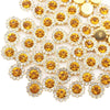 A close-up of sunflower crystal rhinestone sew-on buttons in gold and clear tones.