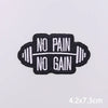 Black embroidered patch with white text saying NO PAIN NO GAIN