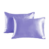 A pair of smooth, lavender satin pillowcases lying flat against a white background.