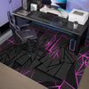 A black and neon pink hexagon patterned area rug used as a gaming desk mat.